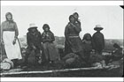 Group of Inuit, three adults, and four children, in summer
